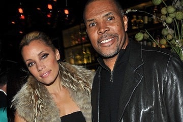 Eriq La Salle smiling in a black leather jacket with his ex-girlfriend Angela Johnson.